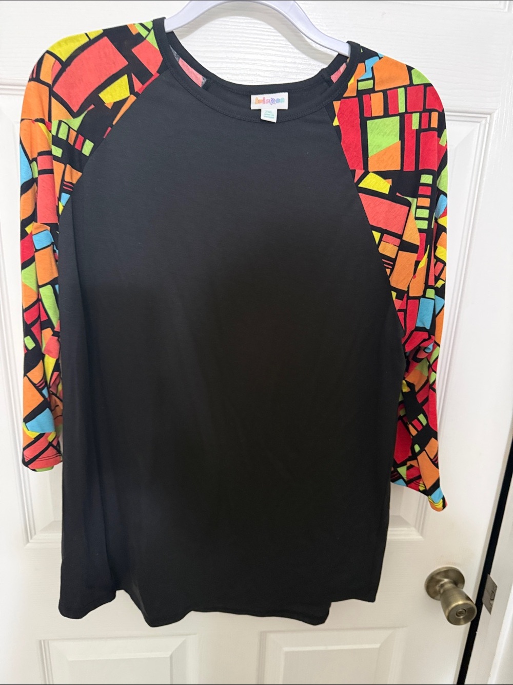 LuLaRoe Black Raglan Top with Bright Geo Colorblock Sleeves